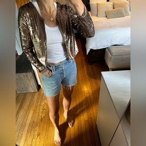 Gold/bronze sequin cropped jacket- dress it up or down! Runs slightly small.
